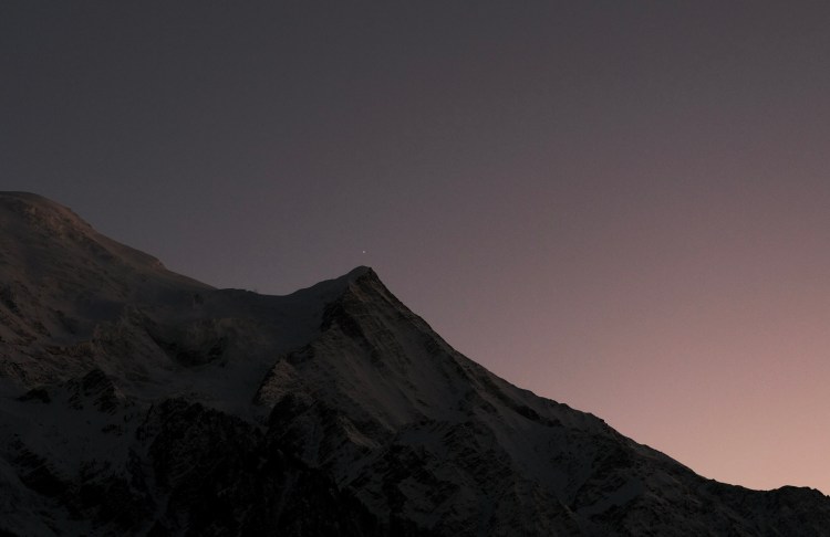 A sunset behind the mountains in Chamonix, France.