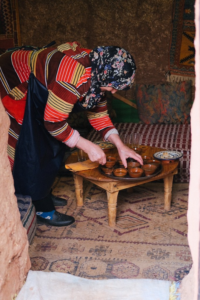 A woman serving traditional Moroccan tea